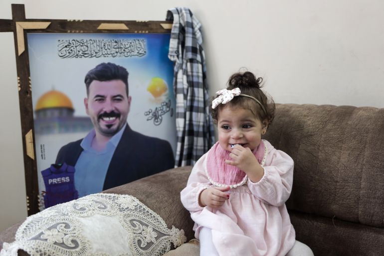 Little Sana, whose birth coincided with the death of her father, Yehiya Sbeih, last year, at her family home in central Gaza City [Abdelhakim Abu Riash/ Al Jazeera]