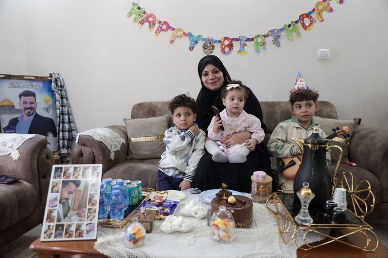The family decided to celebrate Sana’s first birthday despite the deep grief over the loss of the father on the same date [Abdelhakim Abu Riash/Al Jazeera]