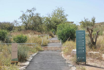 Numerous signs tell the story of the place, but the nature along the pathways remains untamed. Credit: Ilan Assayag Numerous signs tell the story of the place, but the nature along the pathways remains untamed.