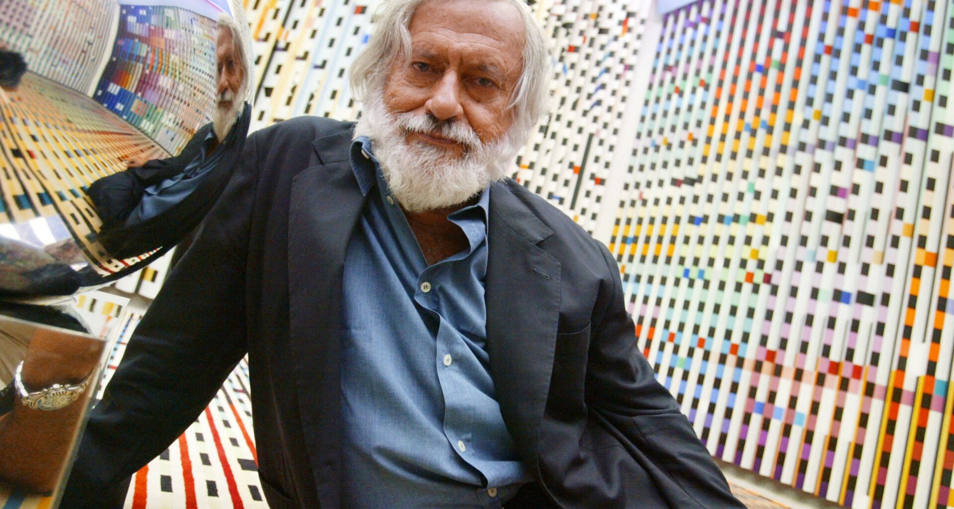 Illustrative: Agam Yaacov, Israeli artist, reclining on one of his works at the Georges Pompidou Art Center, June 28, 2003, in Paris where his works of kinetic sculpture are on exhibit. (Jack GUEZ / AFP)