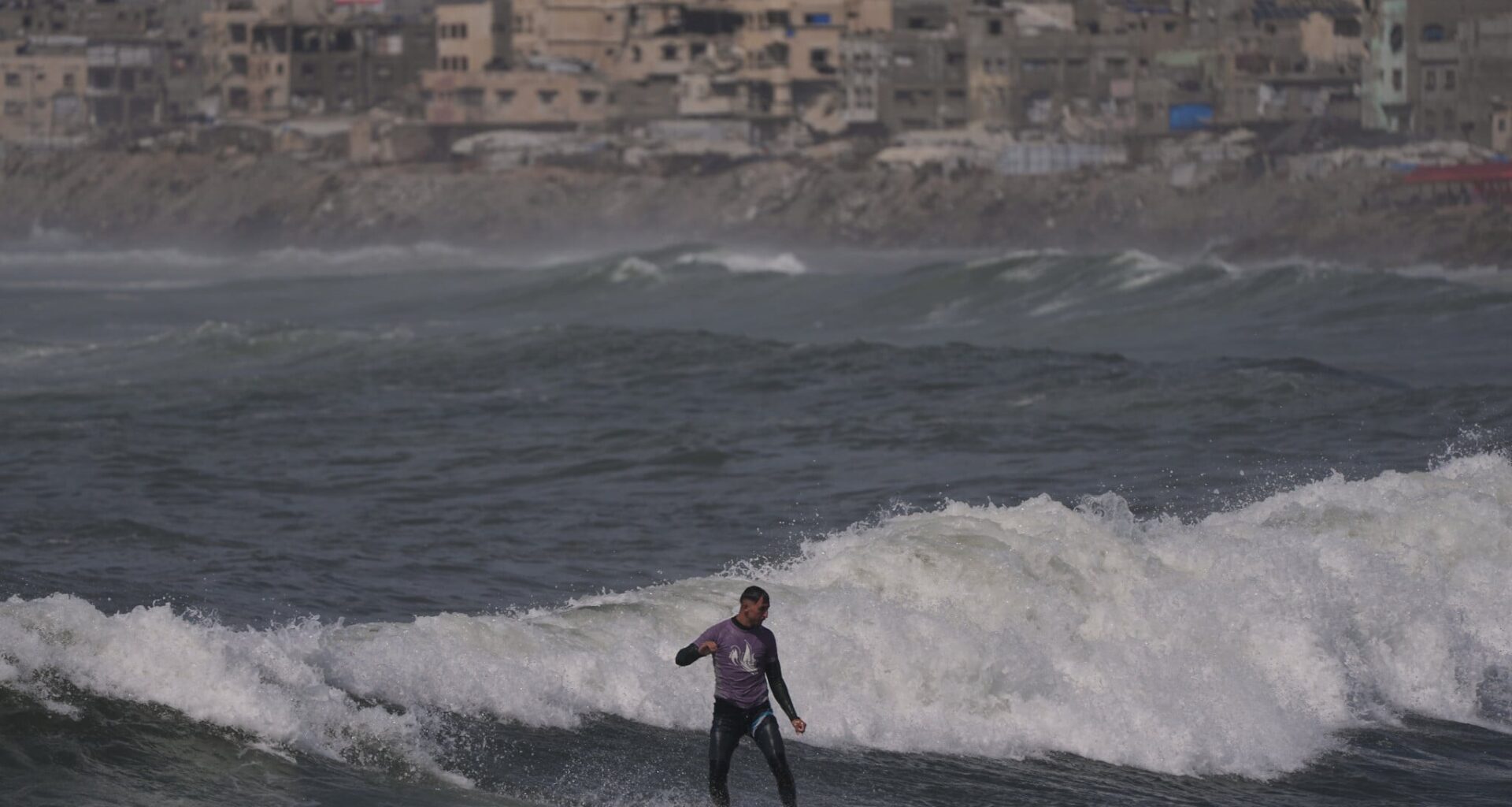 Surfers in war-torn Gaza find rare moments of relief taking to the waves