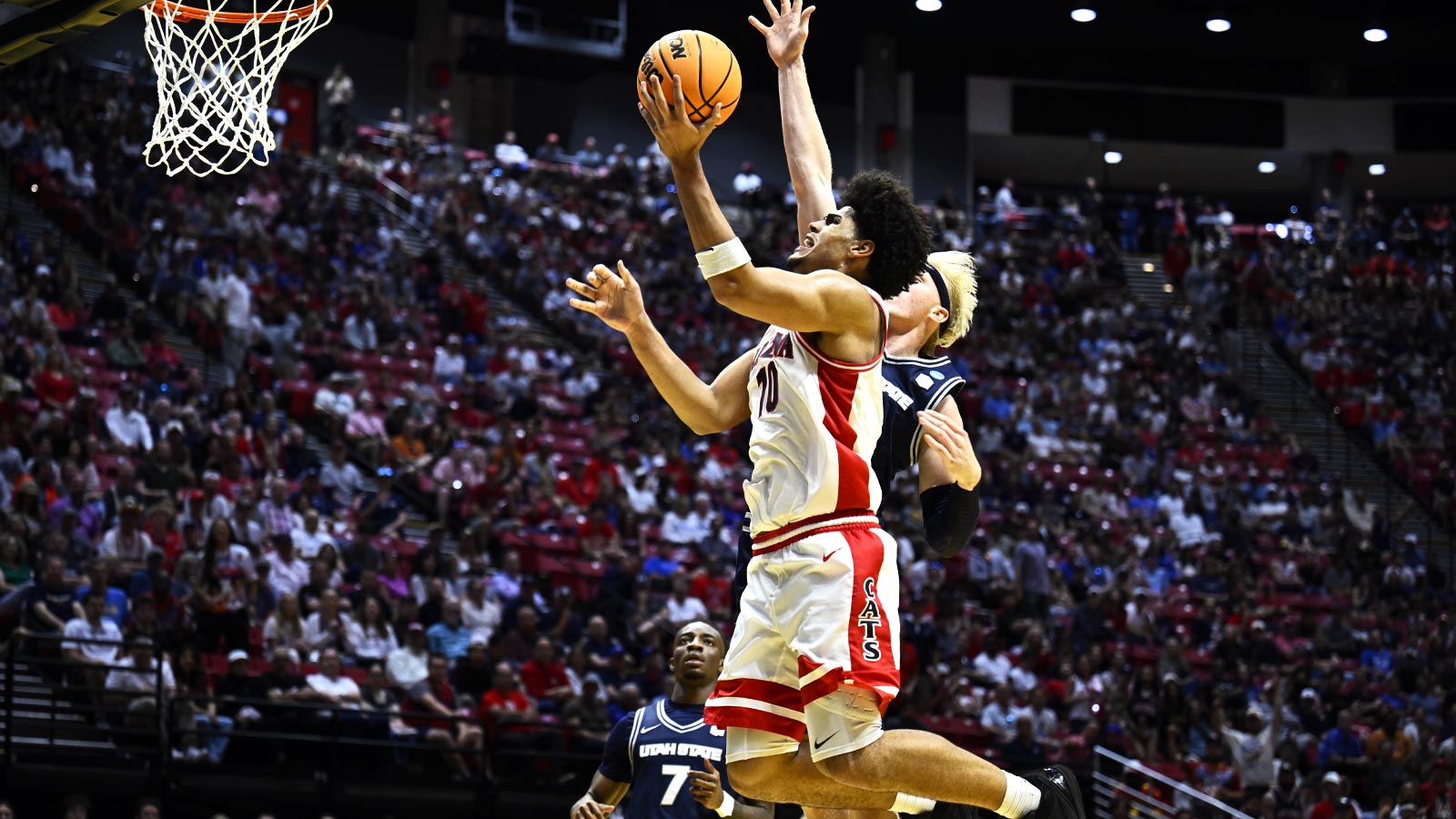 Arizona Wildcats forward Koa Peat (10) shoots against Utah State Aggies forward Karson Templin (22) in the second half during a second round game of the men's 2026 NCAA Tournament at Viejas Arena.