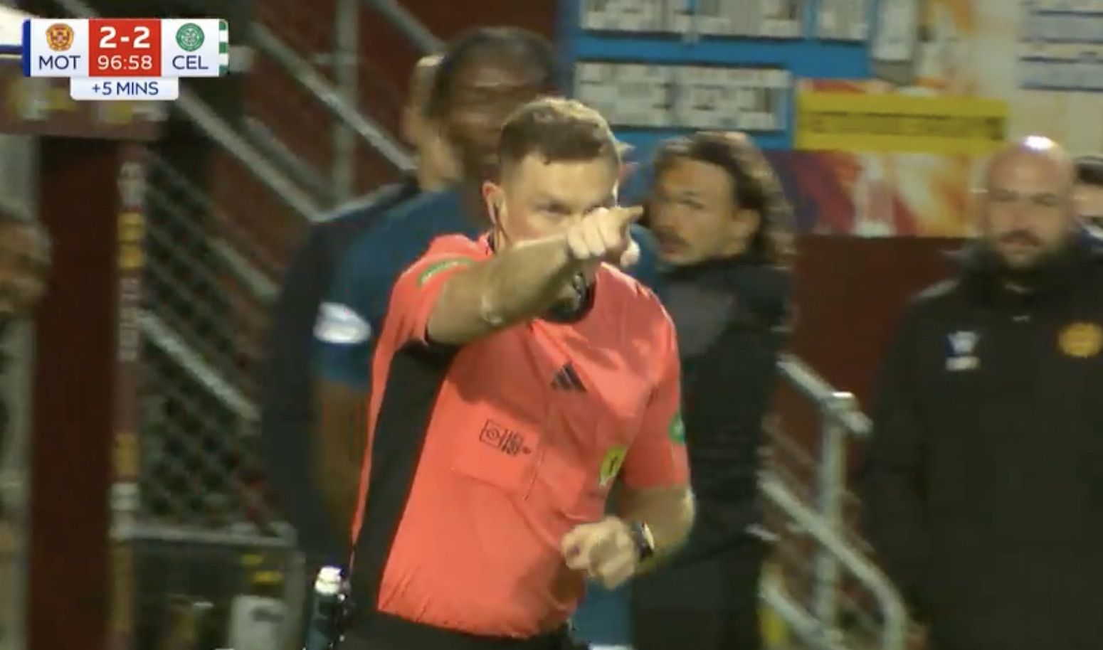 LATE DRAMA: Referee John Beaton points to the spot after consulting VAR