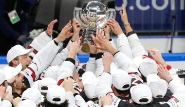 Team Canada players lift the trophy after winning the 2021 IIHF World Championship.