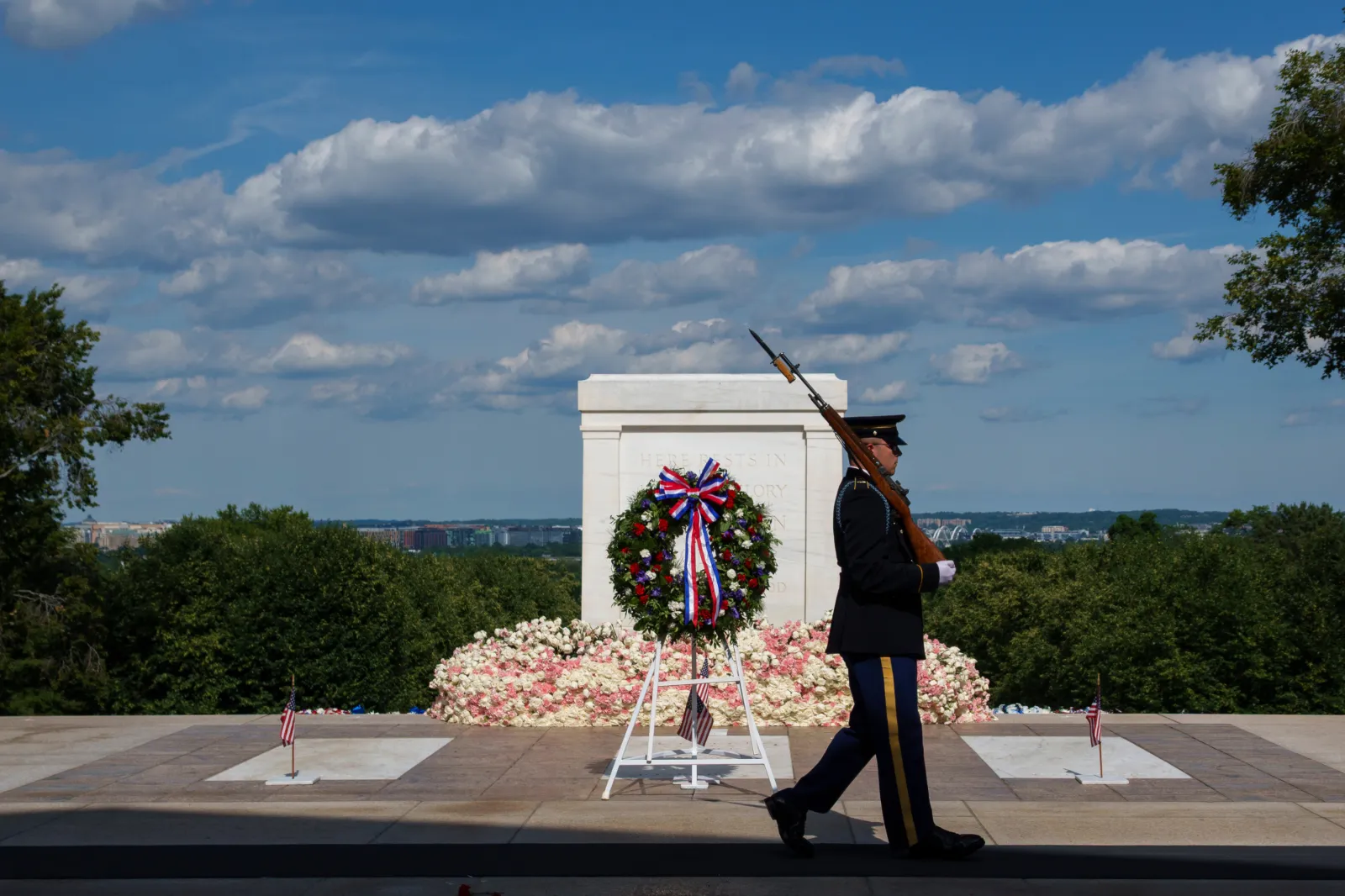 A member of the U.S. Army 3rd Infantry Regiment walks past the Tomb of the Unknown Soldier at Arlington National Cemetery after a changing of the guard ceremony on Memorial Day on May 26, 2025 in Washington, DC.
