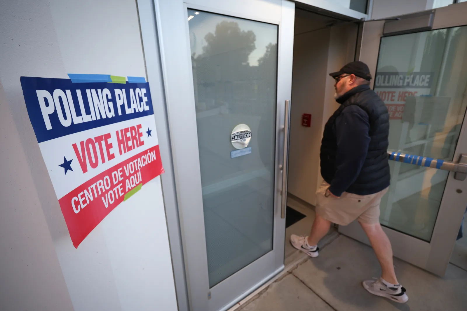 Voters arrive before casting their ballots at a polling location at Washington-Liberty High School on April 21, 2026 in Arlington, Virginia.