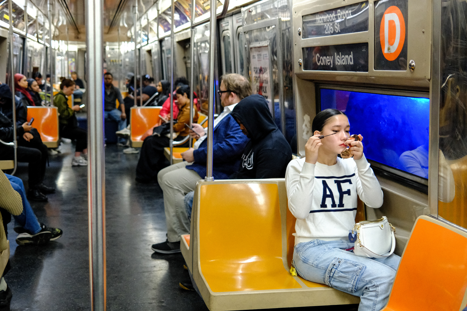 Photo of a subway train full of people