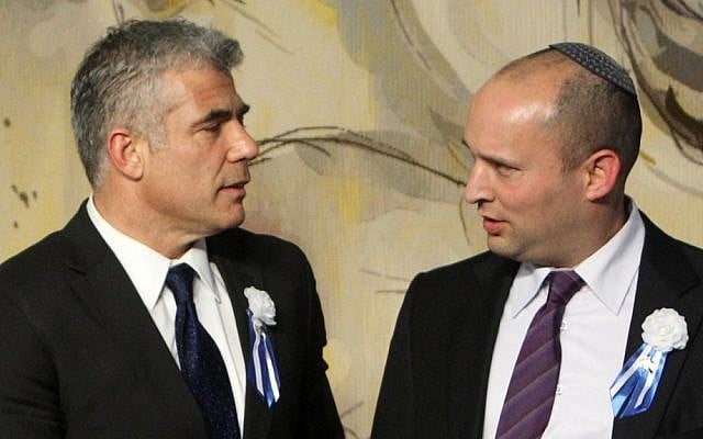 Yesh Atid leader Yair Lapid, left, and Jewish Home chief Naftali Bennett at the opening session of the Knesset last month (Photo credit: Miriam Alster/Flash90)