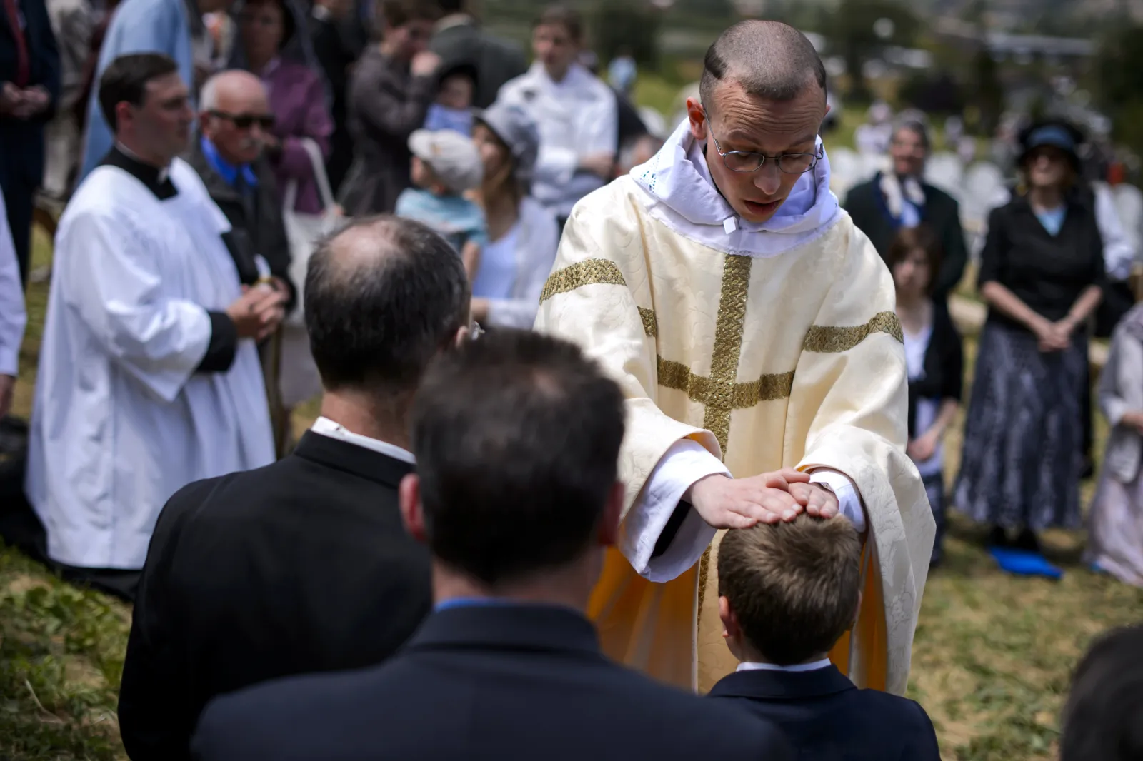 A new priest blesses faithfuls after an ordination Mass of the breakaway fundamentalist Roman Catholic Society of St Pius X, in Econe, western Switzerland, on June 28, 2013.
