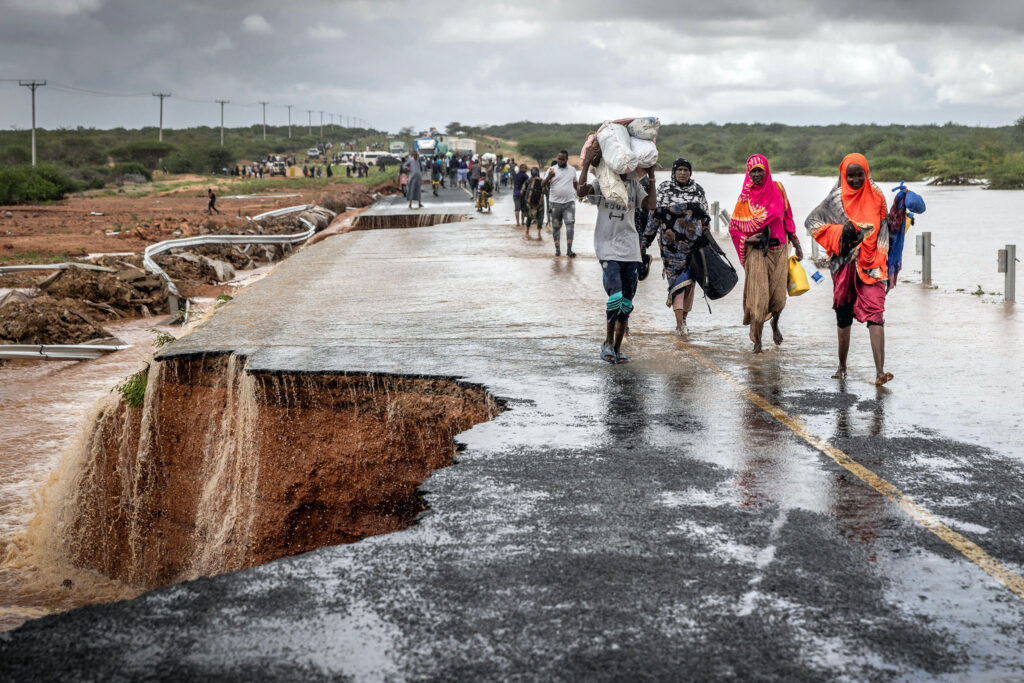 People cross a section of collapsed road during flash flooding linked to El Niño conditions on Nov. 22, 2023, near Garissa, Kenya. Credit: Luis Tato/AFP via Getty Images