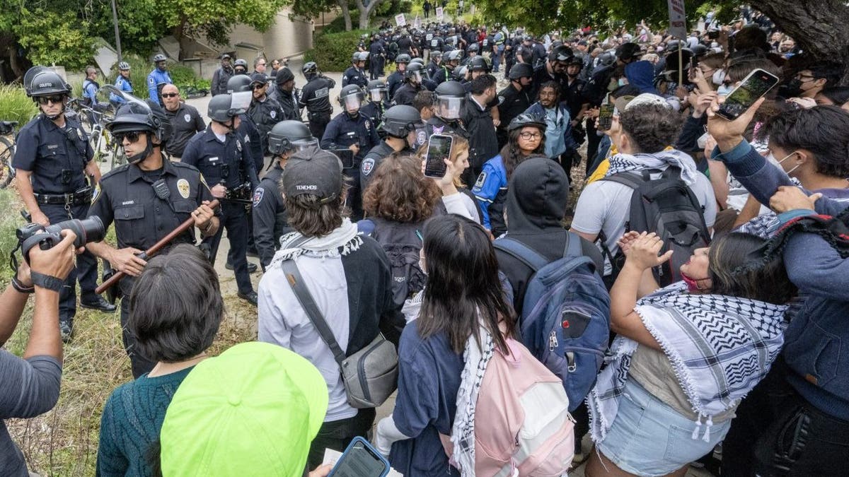 Anti-Israel protesters being pushed back by police on UCLA campus