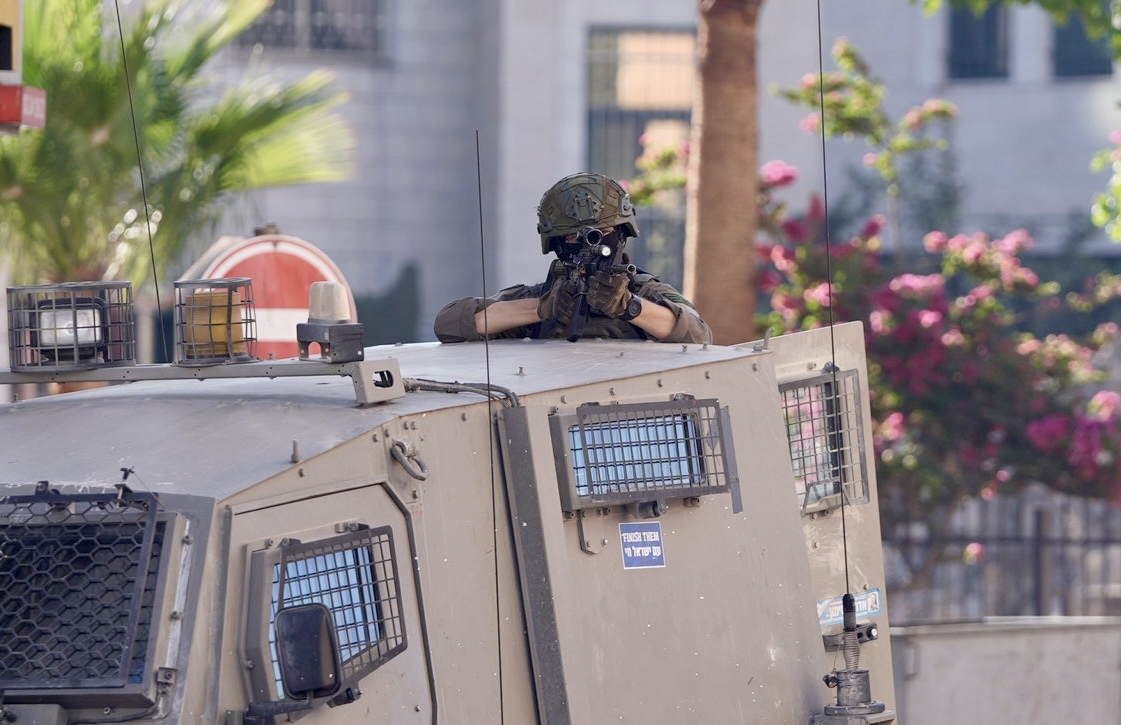 AL-BIREH, WEST BANK - OCTOBER 07: Israeli forces are seen patrolling around during a raid on Al-Bireh, West Bank on October 07, 2025. (Photo by Rimawi Issam/Anadolu via Getty Images)