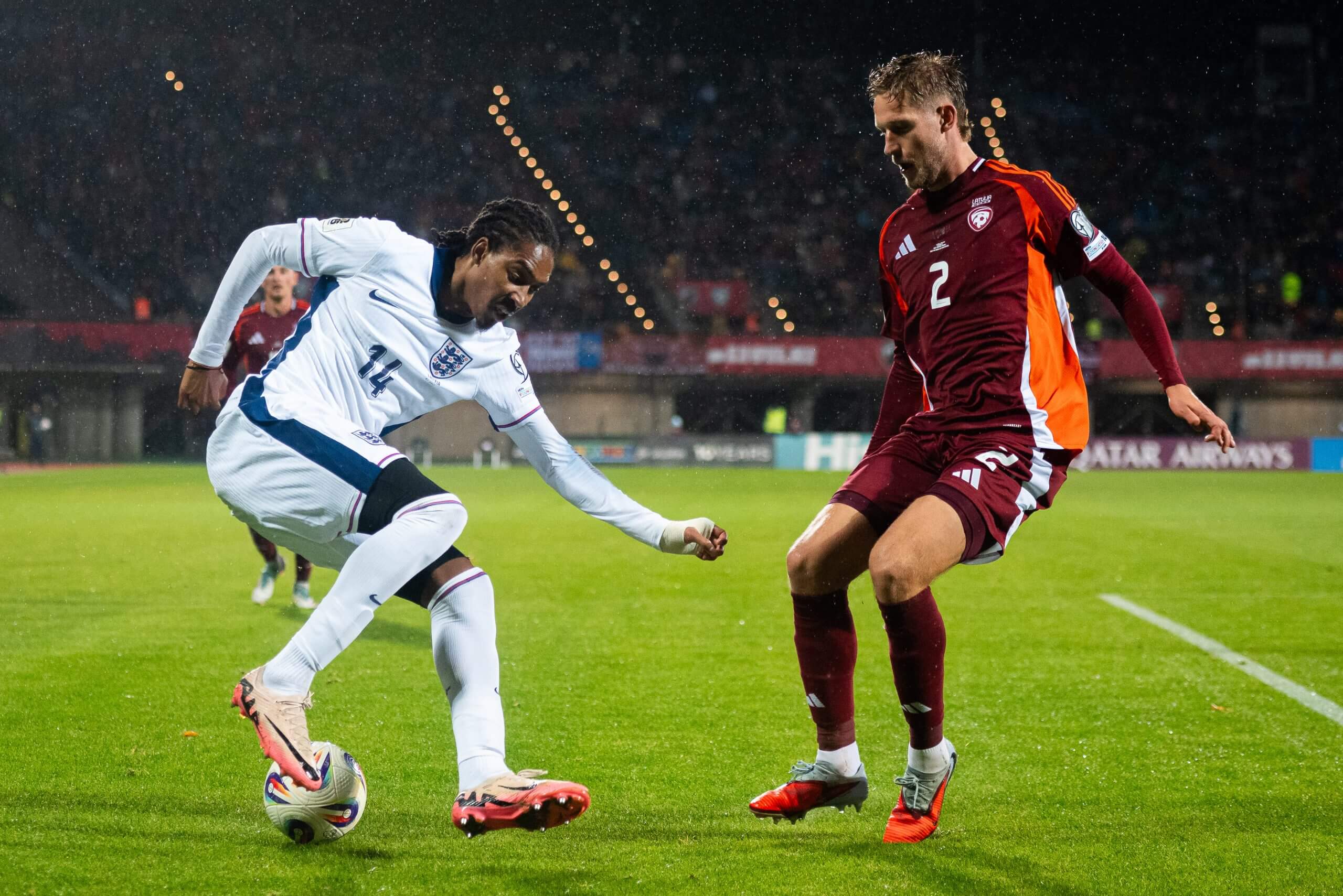 England's Djed Spence pictured taking on Latvia's Daniels Balodis in October 2025
