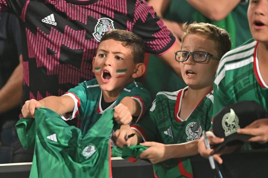 Mexico fans holding football shirts