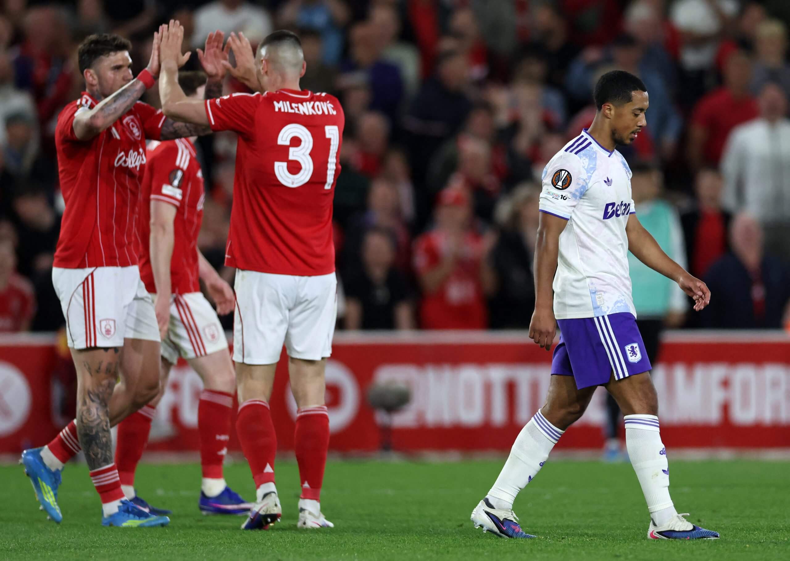 Nottingham Forest's Morato and Nikola Milenkovic celebrate as Youri Tielemans bemoans a missed opportunity