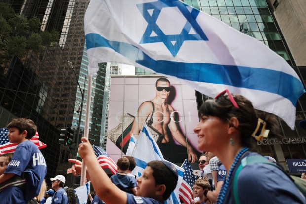 NEW YORK, NEW YORK - MAY 31: Thousands of Jewish and Israeli Americans participate in the annual Israeli Day Parade, the world's largest pro-Israel parade, on May 31, 2026, in New York City. This year's event takes place under heightened security with hundreds of police, K-9 units, and undercover officers patrolling the route up 5th Avenue. New York City mayor Zohran Mamdani did not attend the parade, the first mayor in recent history not to do so. (Photo by Spencer Platt/Getty Images)