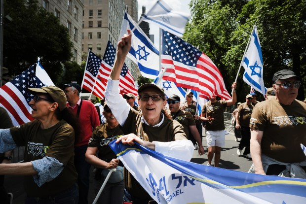 NEW YORK, NEW YORK - MAY 31: Thousands of Jewish and Israeli Americans participate in the annual Israeli Day Parade, the world's largest pro-Israel parade, on May 31, 2026, in New York City. This year's event takes place under heightened security with hundreds of police, K-9 units, and undercover officers patrolling the route up 5th Avenue. New York City mayor Zohran Mamdani did not attend the parade, the first mayor in recent history not to do so. (Photo by Spencer Platt/Getty Images)