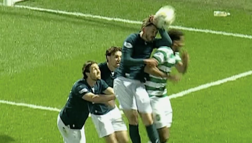 HUGE CALL: Motherwell midfielder Sam Nicholson raises his hand to his forehead in the desperate attempt at a clearance which led to the penalty