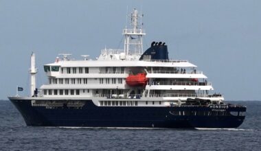 The MV Hondius cruise ship departs the port in Praia, Cape Verde, on May 6.