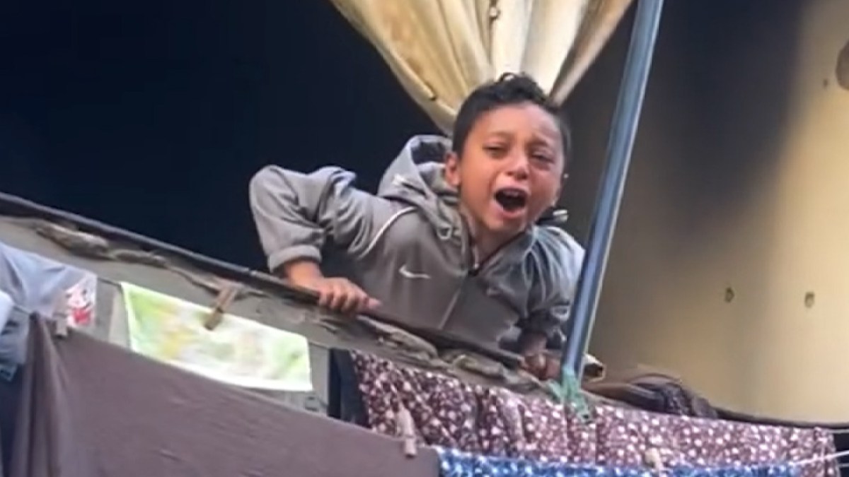 Palestinian boy mourns father killed in Israeli strike on security post | Gaza