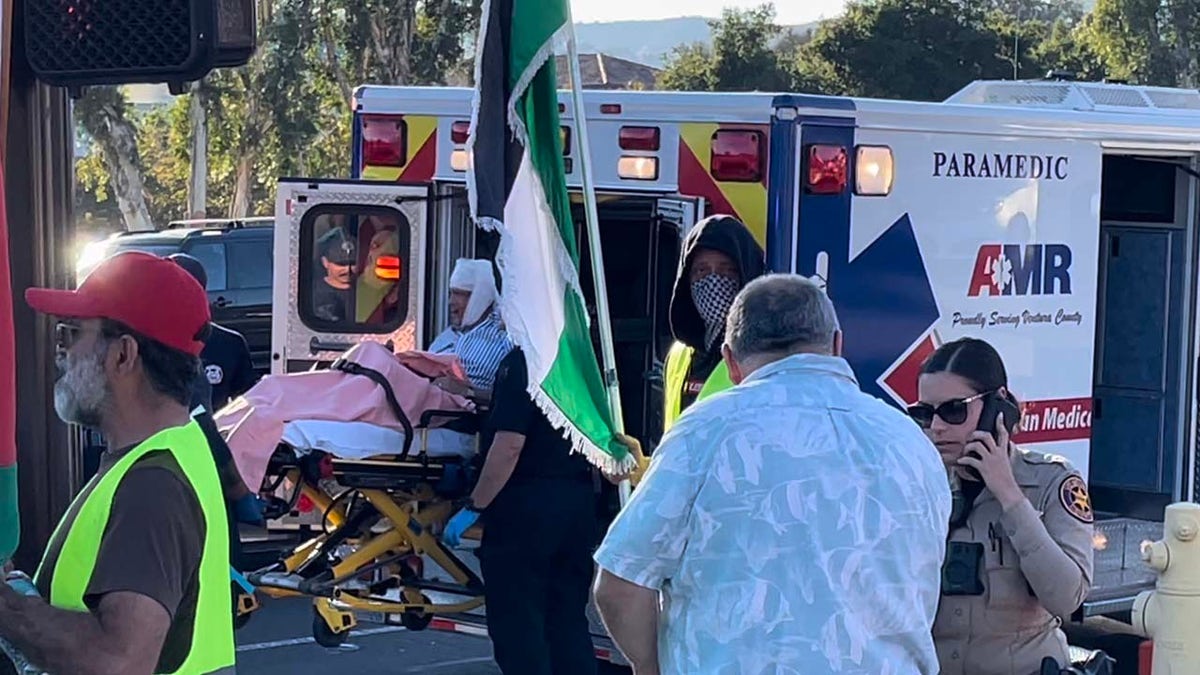 Alnaji seen watching Kessler carried away by medics