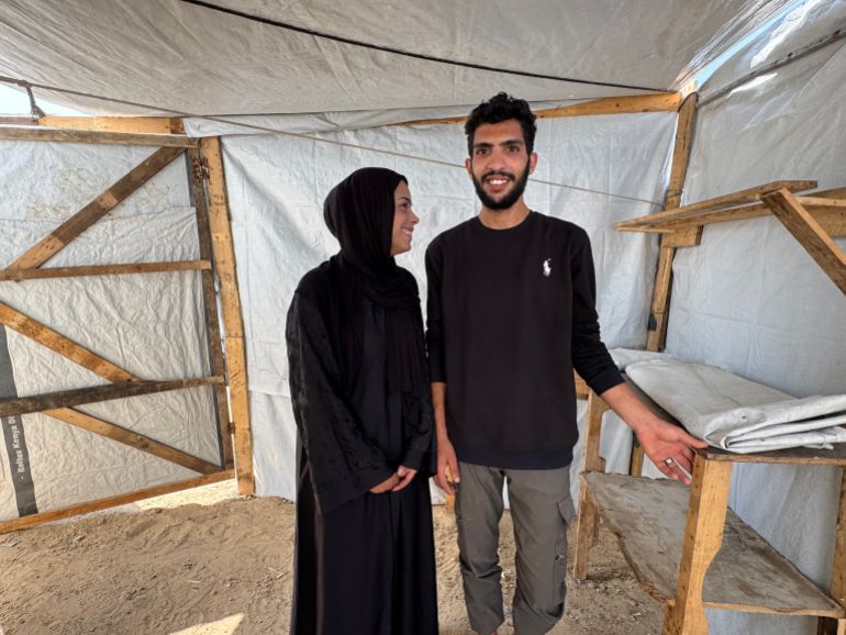The couple, Mohammad Ahliwat and Saja Al-Masri, who are set to get married in a few days, are preparing for their wedding inside a tent in a displacement camp [Al Jazeera]