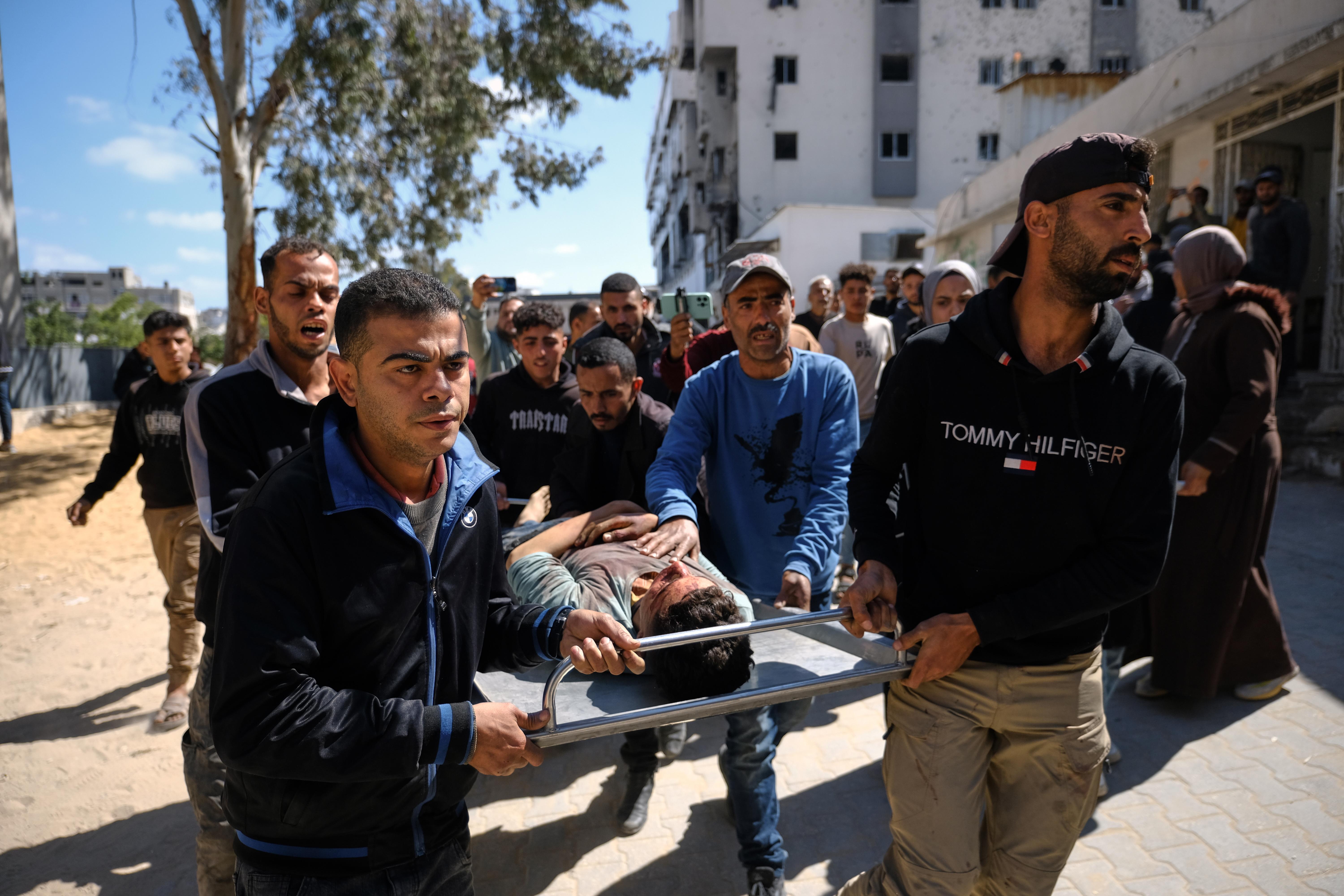 The body of Hamdan Kashko, who was killed in an Israeli airstrike, is taken to a hospital.