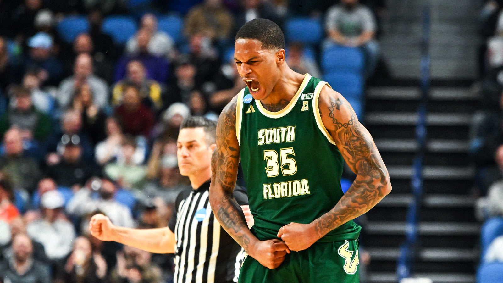 South Florida Bulls forward Izaiyah Nelson (35) reacts to a play during the first half against the Louisville Cardinals during a first round game of the men's 2026 NCAA Tournament at Keybank Center.