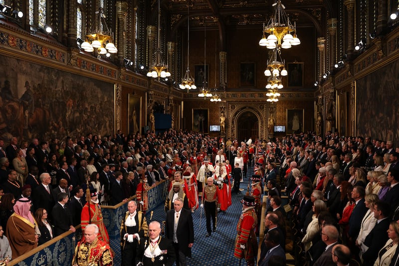 Britain's king Charles and queen Camilla, walk through the Royal Gallery during the State opening of parliament, in the House of Lords at the Palace of Westminster in London. Photograph: Adrian Dennis/PA Wire