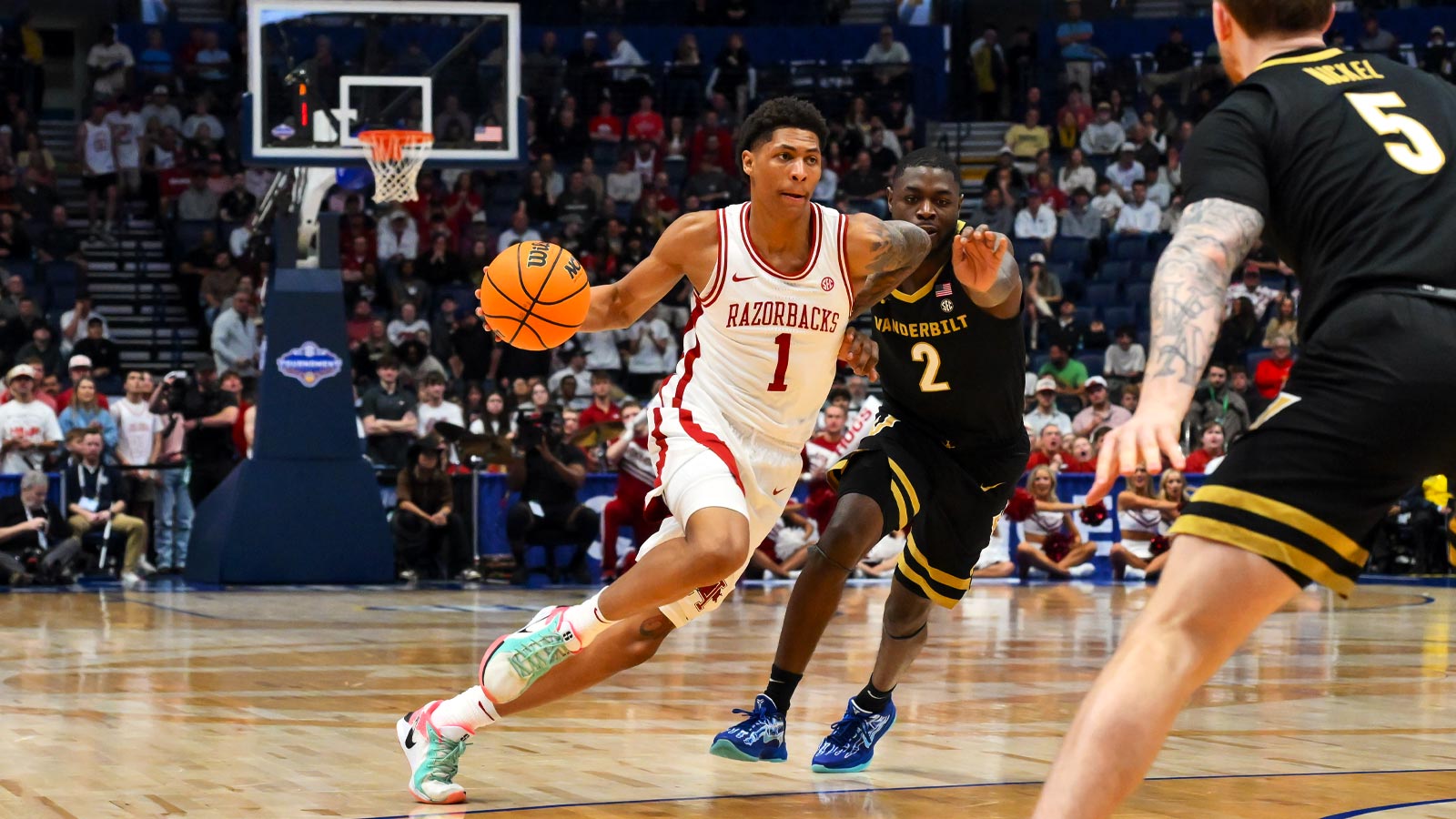Arkansas Razorbacks guard Meleek Thomas (1) drives to the basket past Vanderbilt Commodores guard Duke Miles (2) during the first half during the men's SEC Conference Tournament Championship at Bridgestone Arena. 