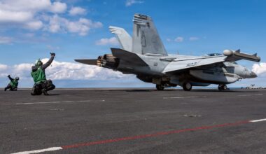 This image provided by US Central Command shows a Navy sailor signaling the launch of a EA-18G Growler on the USS Gerald R. Ford, on Sunday, March 1.
