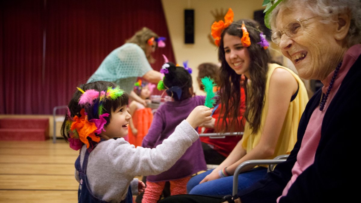 Intergenerational project set up by a kindergarten and a nursing home in Switzerland. The children visit the residents of the nursing home once a week. (Photo by: BSIP/Universal Images Group via Getty Images)