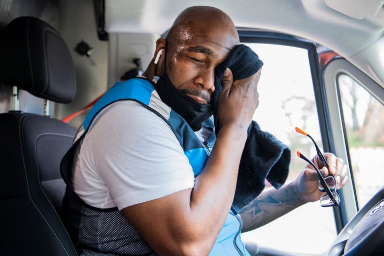 Amazon Delivery UNITED STATES - APRIL 6: Amazon driver Shawndu Stackhouse wipes away sweat while delivering packages in Northeast Washington, D.C., on Tuesday, April 6, 2021. (Photo By Tom Williams/CQ-Roll Call, Inc via Getty Images)