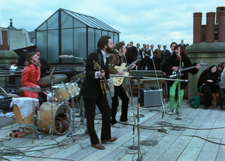 Ringo Starr, Paul McCartney, John Lennon, and George Harrison in THE BEATLES: GET BACK. Photo courtesy of Apple Corps Ltd. THE BEATLES GET BACK Film Still Disney Plus Image via https://press.disney.co.uk/