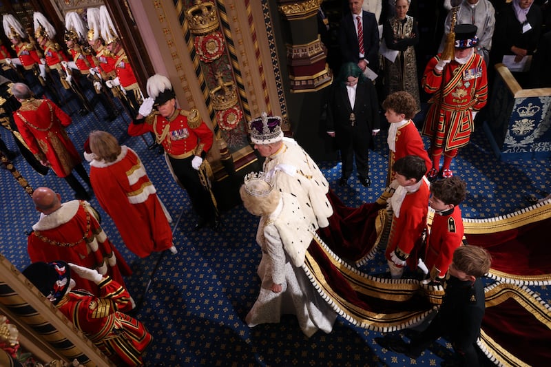 Britain's king Charles and queen Camilla walk through the Royal Gallery during the State opening of parliament, in the House of Lords at the Palace of Westminster in London. Photograph: Adrian Dennis/PA Wire
