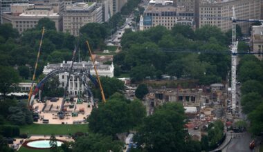 Equipment for a future UFC fight was placed on the South Lawn in front of the White House, on Tuesday, as construction on President Trump's ballroom (right) continued.