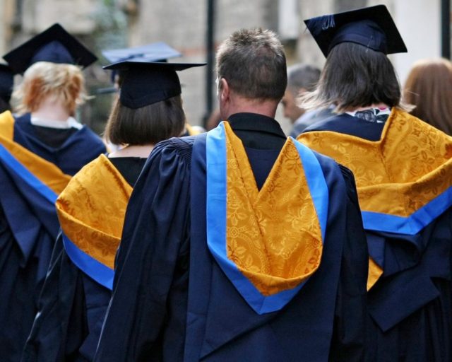 File photo dated 12/10/11 of university graduates at Anglia Ruskin University in Cambridge. University students and graduates aged 40 and under have nearly double the amount of non-student loan debt compared with those who did not attend university, according to research. Issue date: Monday May 16, 2022. PA Photo. Among those with debts, those who attended university have ?12,445-worth of debt on average, excluding any student loans, while people who did not attend university typically owe ?7,105, credit reference agency Equifax found. See PA story MONEY Debt. Photo credit should read: Chris Radburn/PA Wire