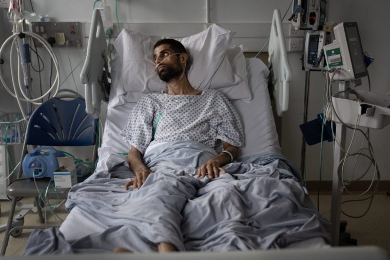 Malik Alkhalil, suffering from silicosis caused by working with man made kitchen work tops copntaining high amounts of silica is treated at the Royal Brompton Hospital by consultant Johanna Feary. 25/7/24. Photo Tom Pilston