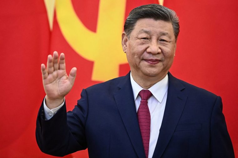 TOPSHOT - Chinese President Xi Jinping waves during a meeting with Vietnam's communist party general secretary To Lam at the Office of the Party Central Committee in Hanoi on April 14, 2025. Chinese leader Xi Jinping warned that protectionism "leads nowhere" and that a trade war would have "no winners", state media said, as he arrived in Vietnam on April 14 on the first leg of a Southeast Asia tour. (Photo by NHAC NGUYEN / POOL / AFP) (Photo by NHAC NGUYEN/POOL/AFP via Getty Images)