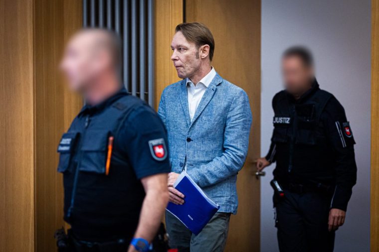 (FILES) Defendant Christian B. (C) is brought to the courtroom for a session of his trial at court in Braunschweig, northern Germany, on September 25, 2024. German law enforcement authorities have voiced alarm that the 