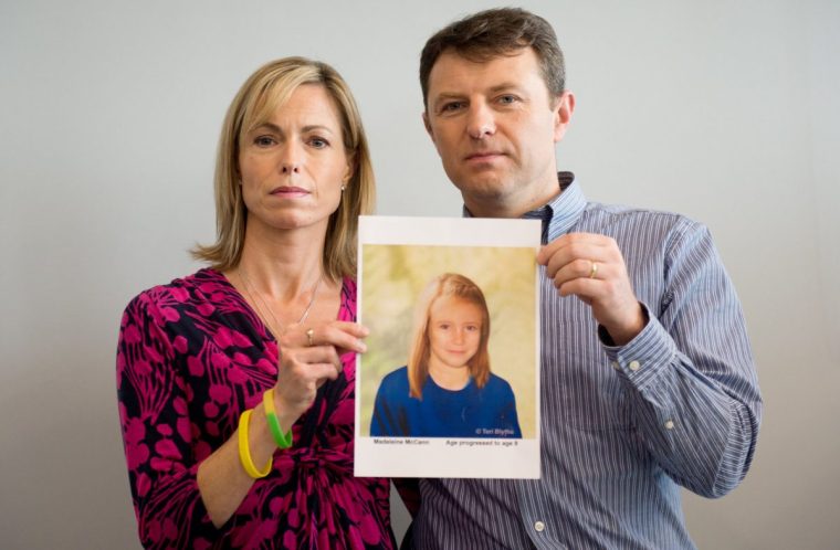 Madeleine McCann, Kate (L) and Gerry McCann (R) pose with an artist's impression of how their daughter might look now at the age of nine ahead of a press conference in central London on May 2, 2012 five years after Madeleine's disappearance while on a family holiday in Portugal. Aged three at the time, the artist's impression depicts how Madeleine may now look, based on family photos of her, along with childhood images of her parents. AFP PHOTO / LEON NEAL (Photo credit should read LEON NEAL/AFP/GettyImages)