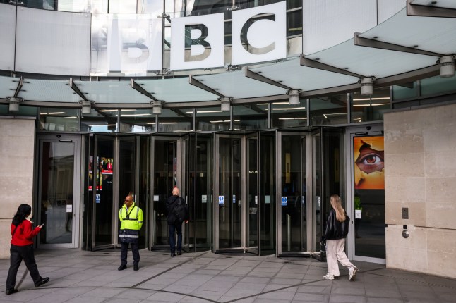 LONDON, ENGLAND - NOVEMBER 12: The logo of the BBC is displayed above the entrance of Broadcasting House on November 12, 2025 in London, England. US President Donald Trump has threatened a $1b law suit against the British broadcaster, alleging a BBC Panorama episode made "false, defamatory, disparaging, misleading, and inflammatory statements about President Trump." Trump's accusations followed the Telegraph's publication of a memo by Michael Prescott, a former external adviser on editorial standards at the BBC, which raised concerns over the selective edit of a January 6, 2021 speech made by Trump to supporters that aired in a BBC Panorama episode ahead of the 2024 US election. A letter from Trump's lawyers outlines demands to the BBC to retract the documentary, issue an apology, and compensate Trump for "the harm cased" by November 15, or else face legal action. On Sunday, BBC Director General Tim Davie and Deborah Turness, head of BBC News, resigned over Prescott's accusations of "systemic" bias in the outlet's news coverage on Trump, the Israel-Gaza conflict, and transgender issues. (Photo by Leon Neal/Getty Images)