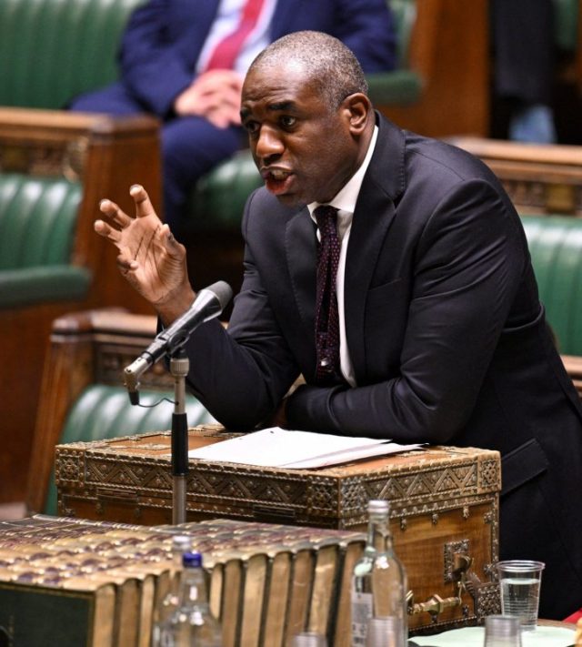 This handout photograph taken and released by the UK Parliament's House of Commons on December 2, 2025 shows Britain's Justice Secretary David Lammy speaking about criminal court reform during a session of parliament in central London. Britain's justice minister on December 2 unveiled a "once in a generation" package of reforms to tackle an "emergency" in the court system, including plans to scale back jury trials in England and Wales. (Photo by Handout / House of Commons / AFP via Getty Images) / RESTRICTED TO EDITORIAL USE - MANDATORY CREDIT " AFP PHOTO / House of Commons " - NO USE FOR ENTERTAINMENT, SATIRICAL, MARKETING OR ADVERTISING CAMPAIGNS - EDITORS NOTE THE IMAGE MAY HAVE BEEN DIGITALLY ALTERED AT SOURCE TO OBSCURE VISIBLE DOCUMENTS - BEST QUALITY AVAILABLE /