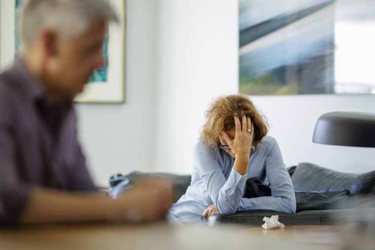 BERLIN, GERMANY - AUGUST 13: Symbolic photo on the topic of problems in a relationship. An older woman and an older man are sitting at home on August 13, 2024 in Berlin, Germany. (Photo Illustration by Thomas Trutschel/Photothek via Getty Images)