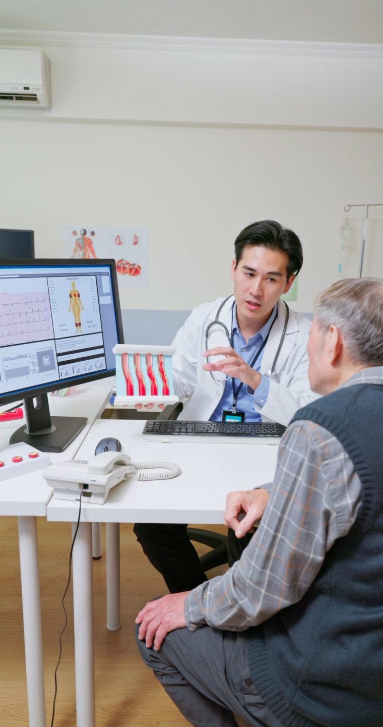 A doctor discusses heart disease with a patient