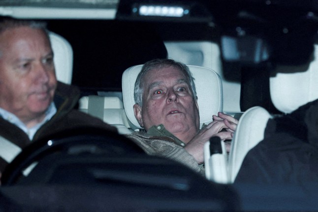 Andrew Mountbatten Windsor, younger brother of Britain's King Charles, formerly known as Prince Andrew, leaves Aylsham Police Station in a vehicle.