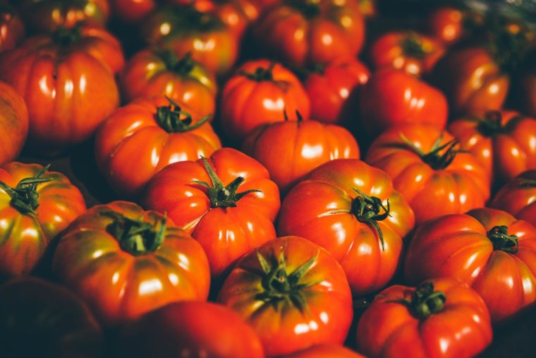 Fresh organic tomato closeup .