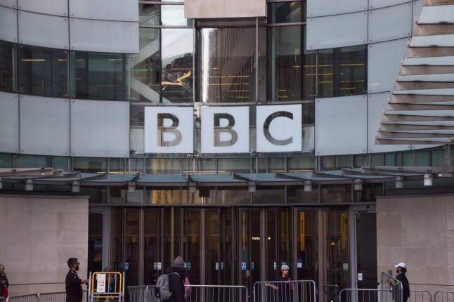 London, UK - October 11 2024: people walk outside Broadcasting House, the BBC headquarters in central London.