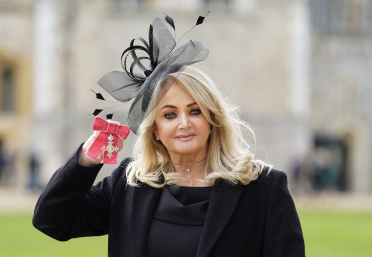 (FILES) British singer Gaynor Sullivan aka Bonnie Tyler poses with her medal after being appointed a Member of the Order of the British Empire (MBE) during an investiture ceremony at Windsor Castle on February 1, 2023. Husky-voiced Welsh singer Bonnie Tyler was 