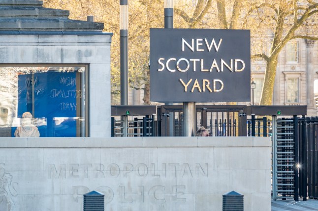 The New Scotland Yard sign on Victoria Embankment in City of Westminster, London. This is the London police HQ.